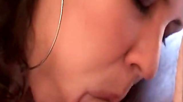 Girlfriend in big earrings gives a blowjob