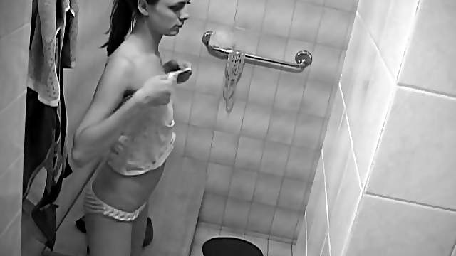 Sexy brunette teen strips nude in bathroom