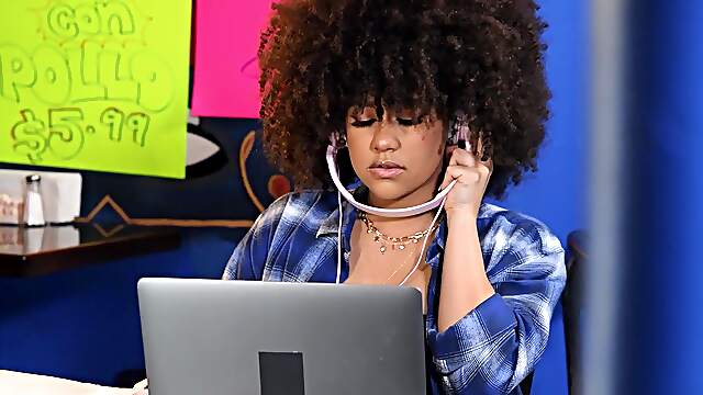 Curly ebony shakes them big naturals while being rammed by white cock