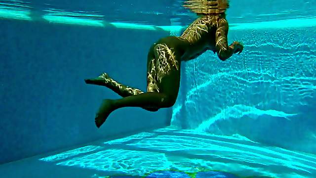 Sexy girl goes skinny dipping as we watch underwater