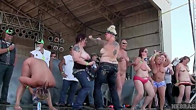 Chubby topless amateurs dancing on concert stage