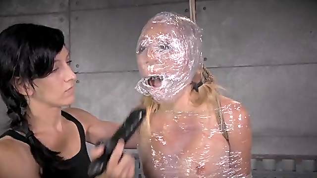 Head to toe plastic wrap and rope bind a slave