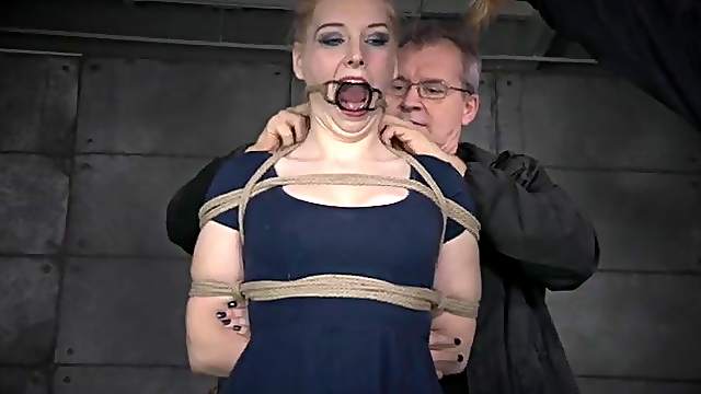 Rope bound girl with small tits takes a whipping