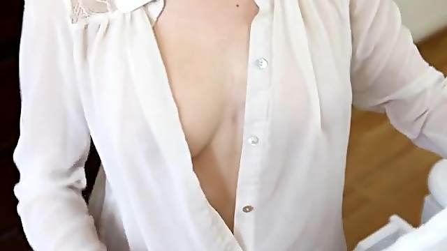 Elegant white blouse on a lady showing off her tits
